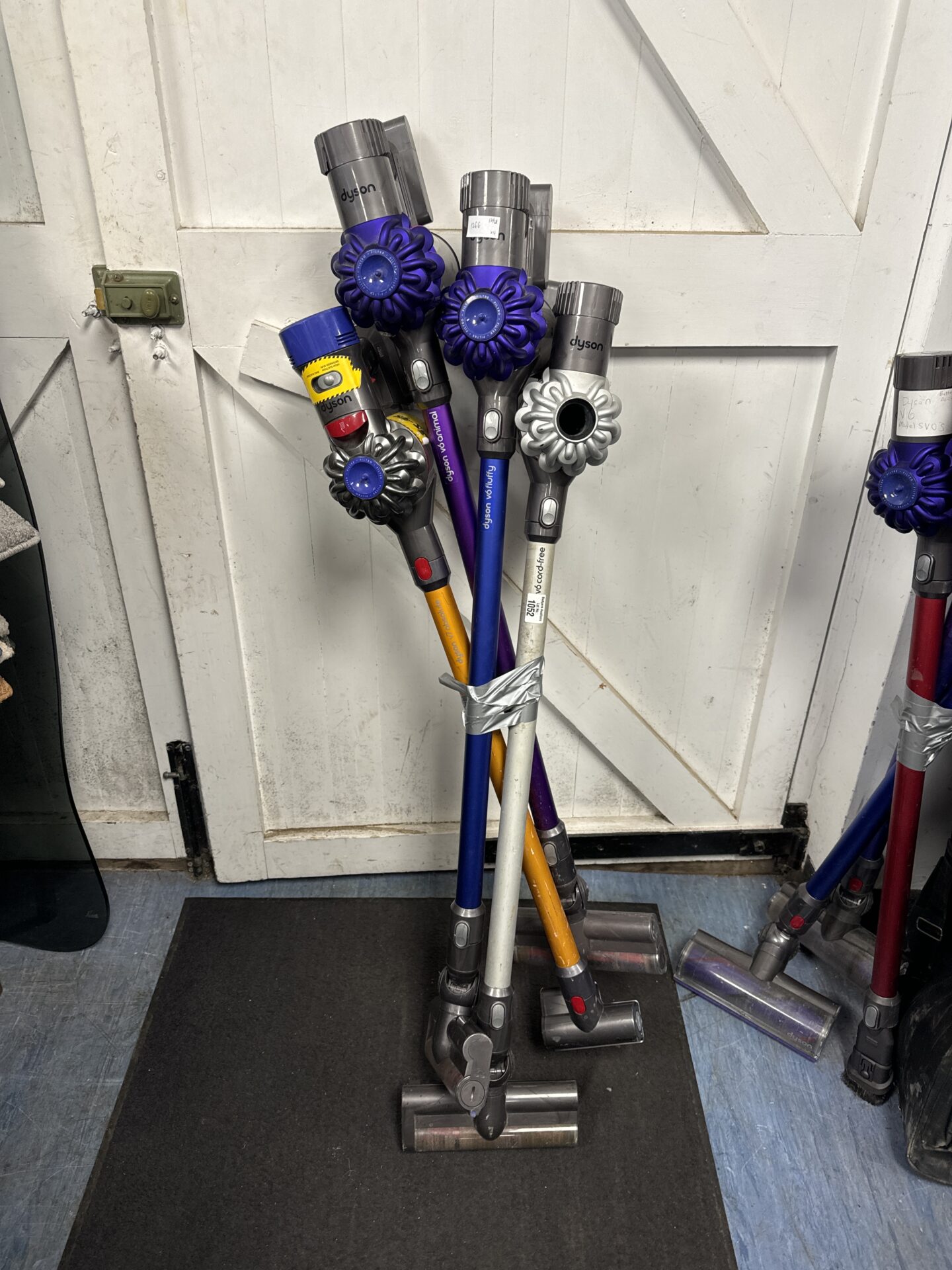 1052 Four Dyson cordless hoovers for spares