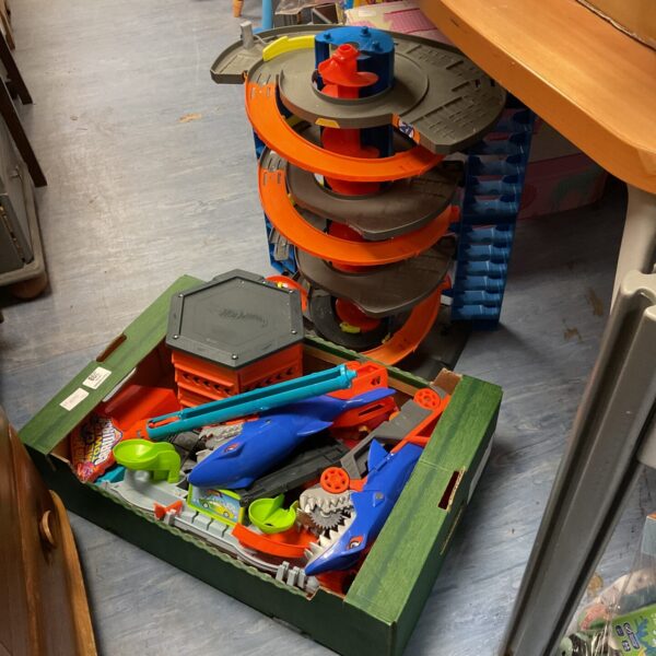 Hot Wheels track set with various attachments and building pieces.