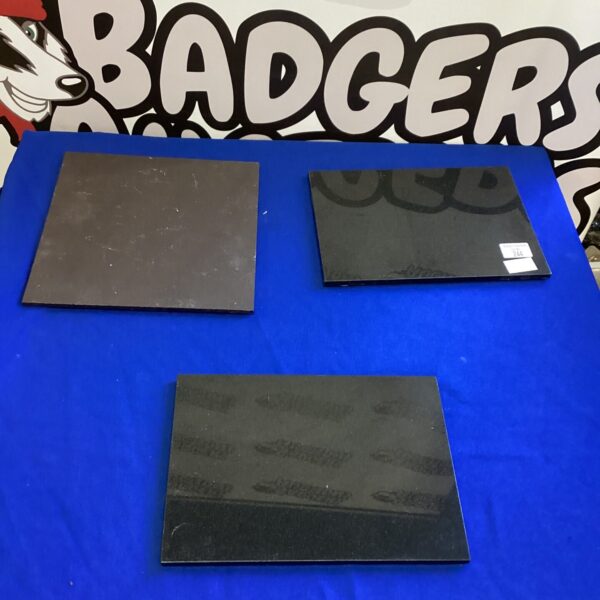 Dark granite and slate worktop protectors for kitchen counters.