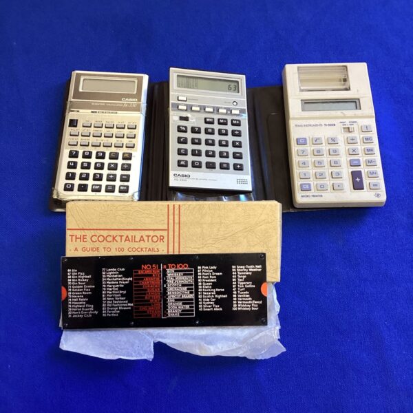 Vintage calculator lot featuring Casio and Texas Instruments models.
