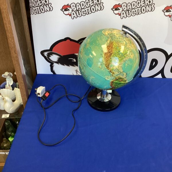 Vintage WH Smith globe with detailed geographical markings.