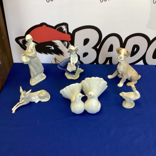 Delicate Lladro porcelain dog figurine, detailed and collectible.