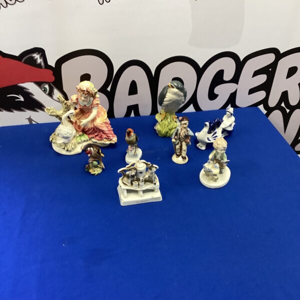 Vintage porcelain figurines including Royal Doulton and Beswick collectables.