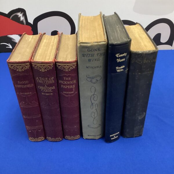 Vintage book collection featuring Gone With The Wind and Dickens novels.
