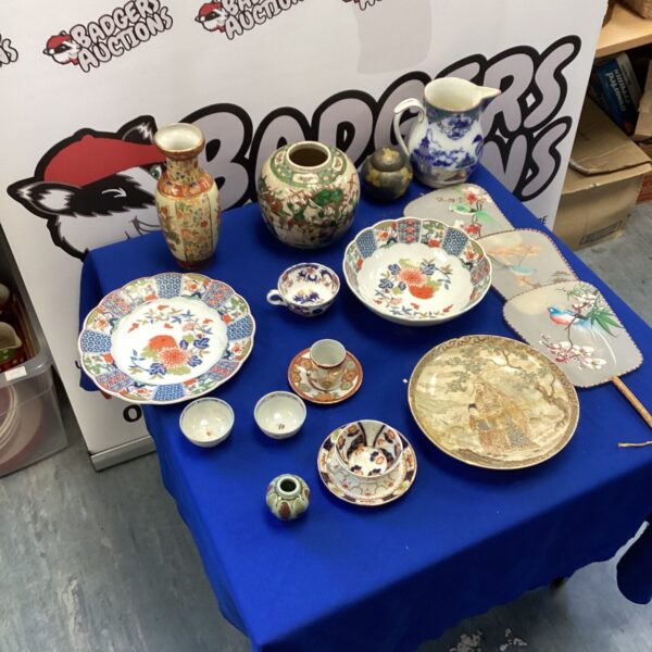 Vintage Japanese porcelain collection with ginger jars and decorative pieces.