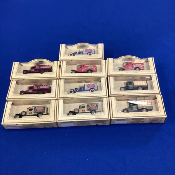 Lledo diecast commercial vehicle lot with various vans and trucks.