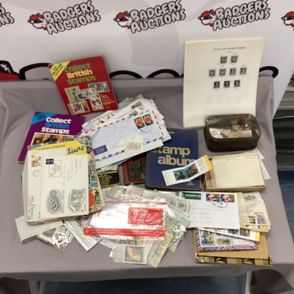Vintage stamp collecting lot with albums and loose stamps.