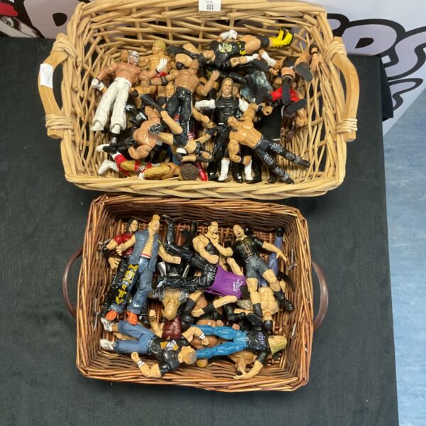 Two wicker baskets filled with a large lot of WWE figurines.