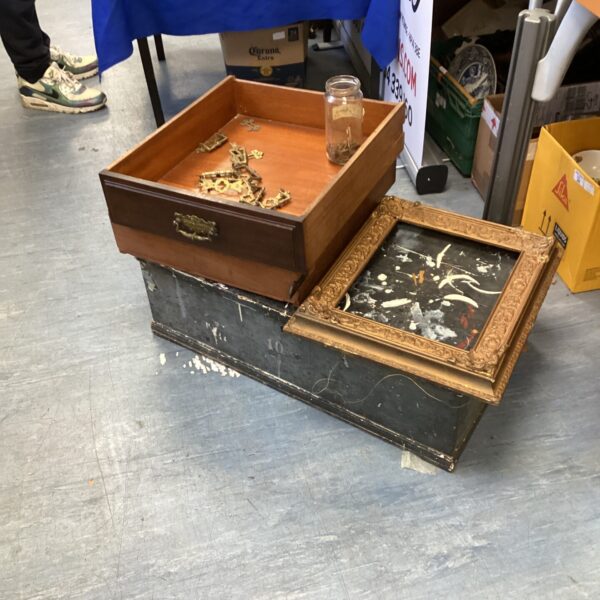 Vintage wooden tool box with brass handles and a picture frame.