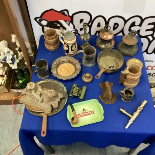 Vintage brass and metalware lot with jugs and candlesticks.