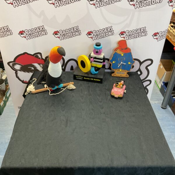 Mixed toy lot featuring Paddington, Mickey Mouse, and a toucan.