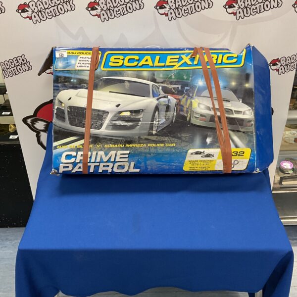Scalextric Crime Patrol set with Audi R8 and Subaru Impreza cars.