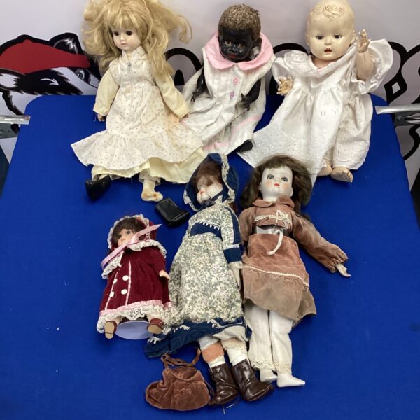 Vintage dolls lot with ceramic and antique examples.