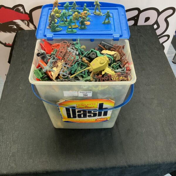 Vintage Dash soldiers and accessories in a storage box.