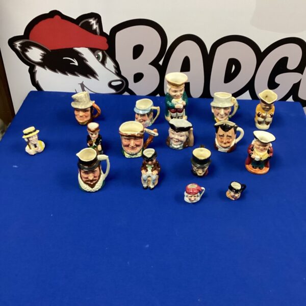 Collection of vintage miniature Toby Jugs for collectors.