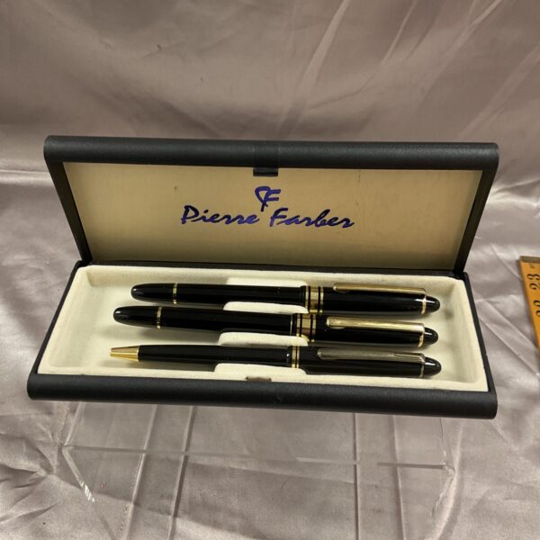 Pierre Faber pen set in black and gold, vintage writing instrument.