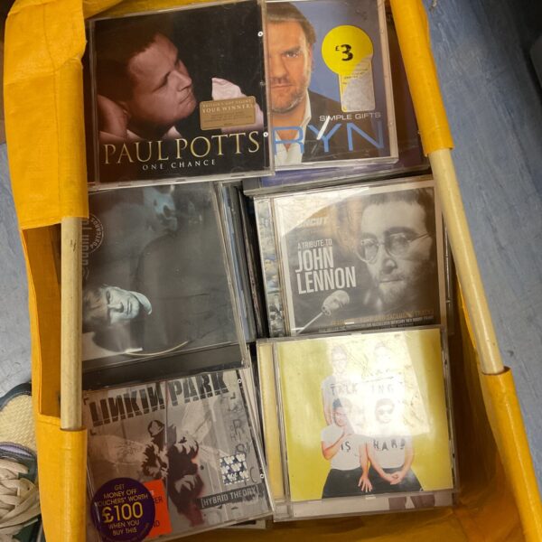 CD collection featuring John Lennon and Linkin Park albums.