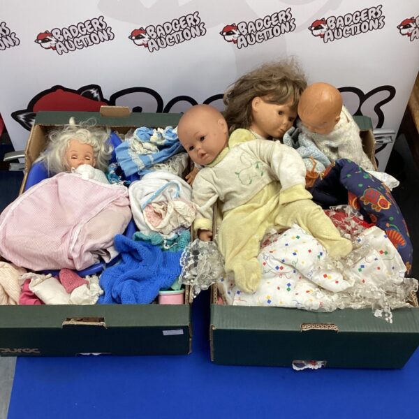 Vintage dolls and clothing lot for collectors and enthusiasts.