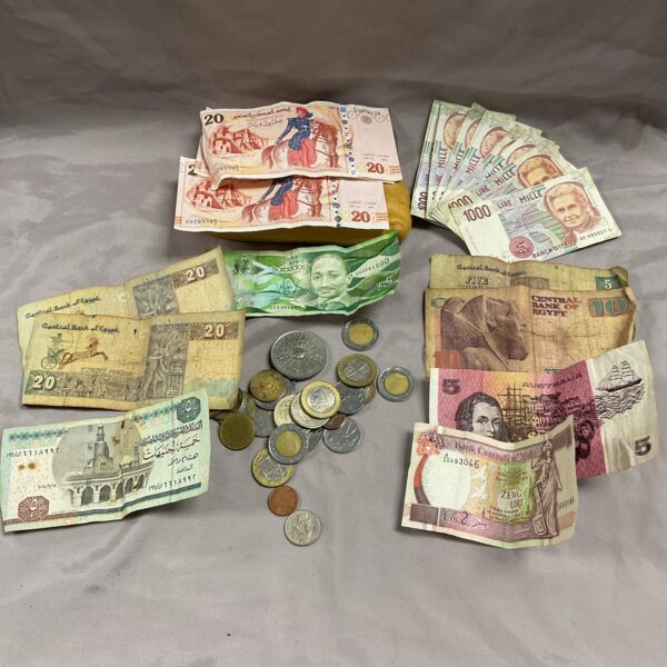 Assorted currency lot featuring banknotes and coins from various countries.