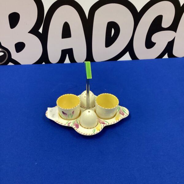 Vintage Burleigh egg cup set with floral design on a white background.