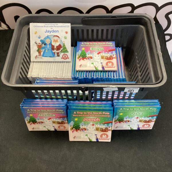Collection of personalised Christmas books for children.