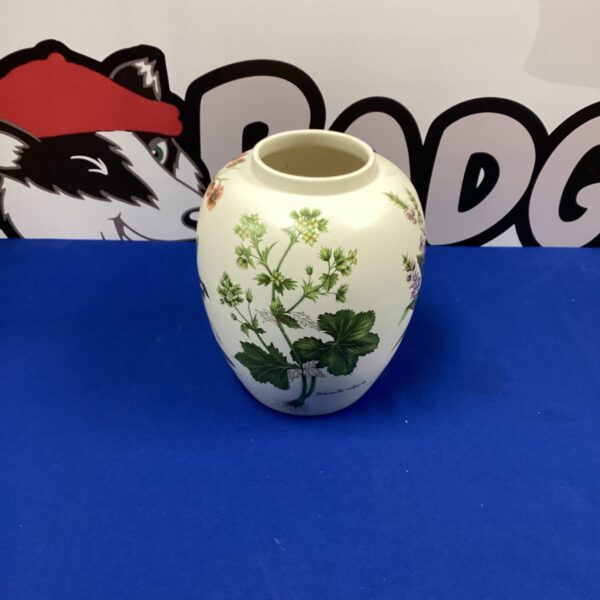 Vintage Poole Pottery vase with a colourful floral design.