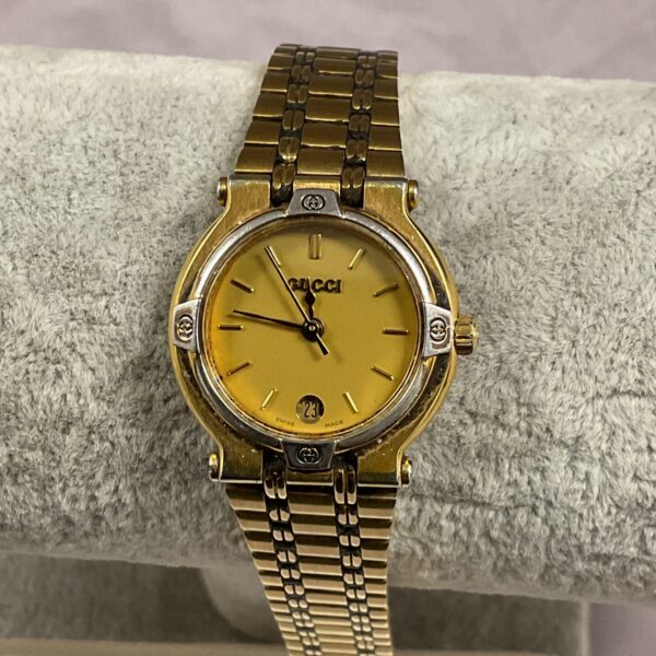 Gold Gucci ladies wristwatch from 1989, vintage style.