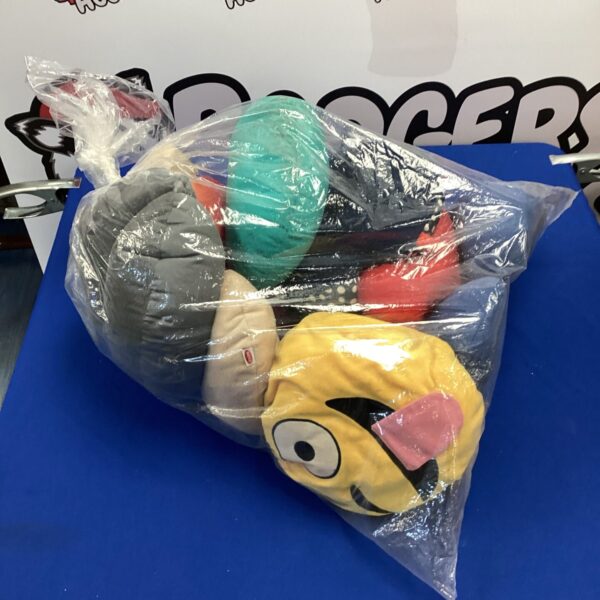 Collection of colourful neck cushions in plastic packaging.