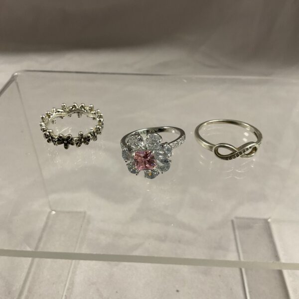 Close-up of a silver floral ring in a lot.