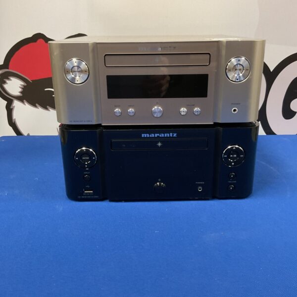 Stacked Marantz CD receivers, silver finish, vintage audio equipment.
