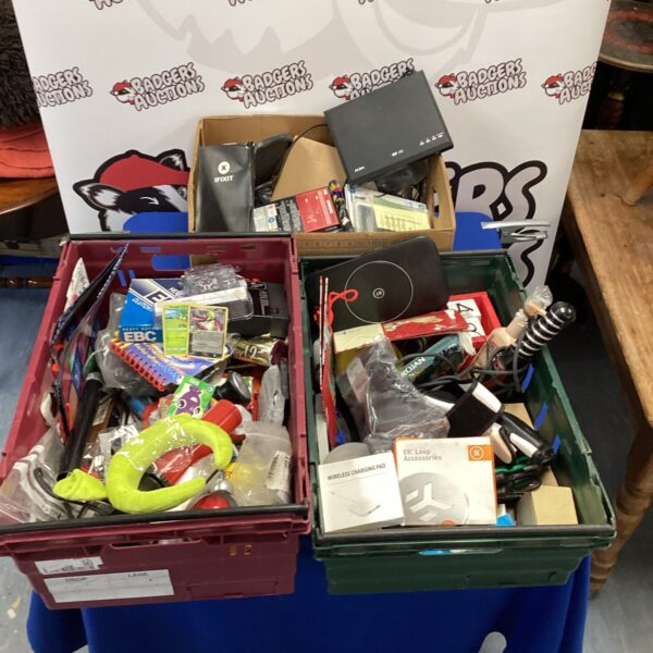 House clearance lot with Pokemon cards, DVD player and wireless charger.
