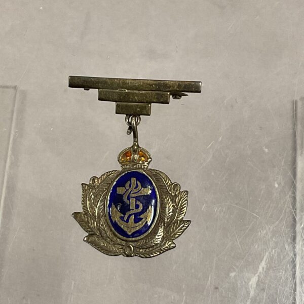 Vintage navy sweetheart brooch with blue enamel detail.
