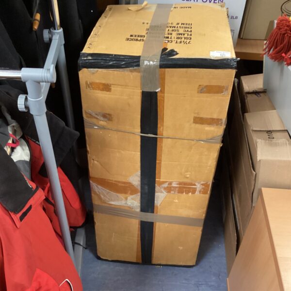 Boxed artificial Christmas tree ready for holiday decorating.