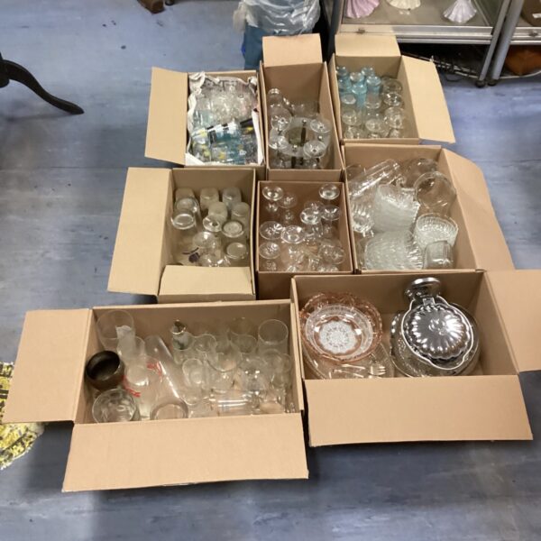 Large lot of mixed glassware including tumblers and wine glasses.