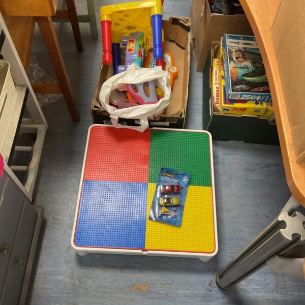 Colourful childrens Lego table with toy lot including playset.