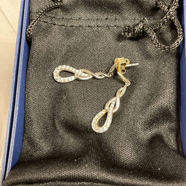 Elegant silver infinity drop earrings for women.