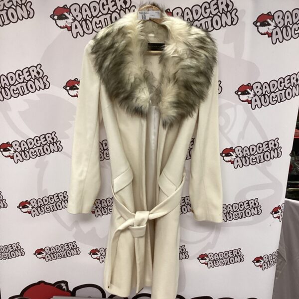 Ladies’ size 14 Speziale full length coat with fur collar.