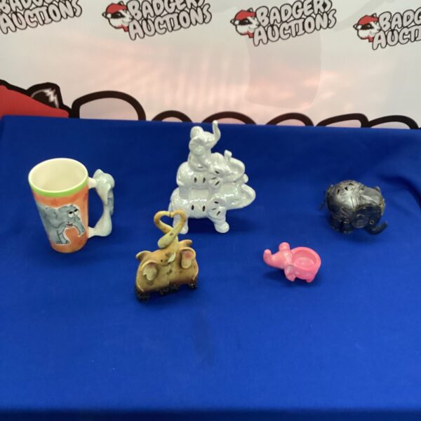 Selection of vintage ceramic elephant ornaments for collectors and home decor.
