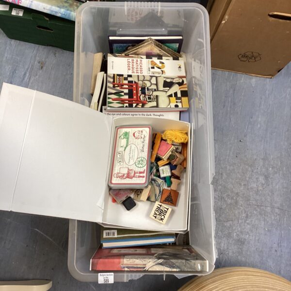 Mixed lot of art books and vintage printing blocks for crafting.