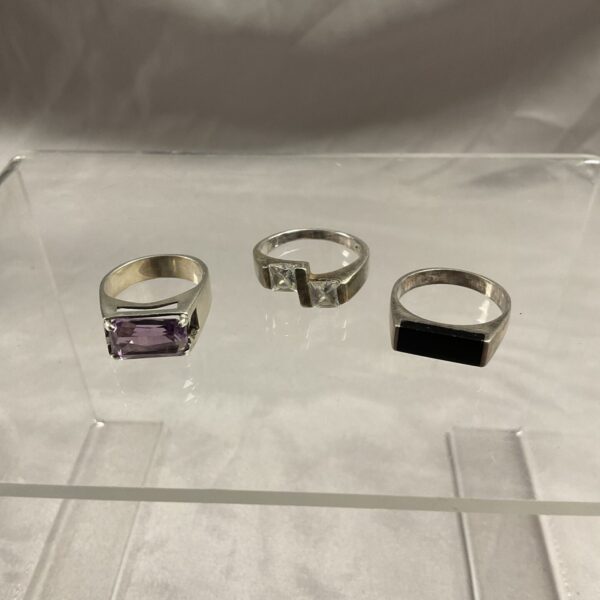 Silver stone set rings lot in varying sizes.