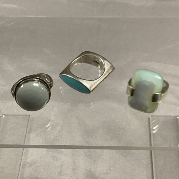 Lot of three vintage silver stone rings in varying sizes.