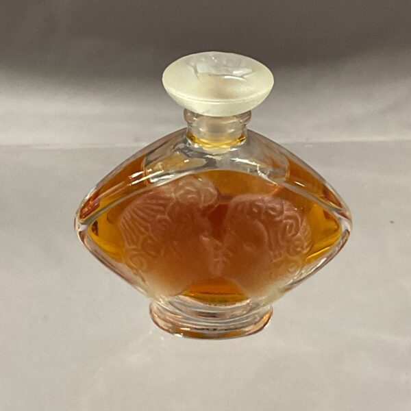 Vintage Lalique perfume bottle with embossed floral design.