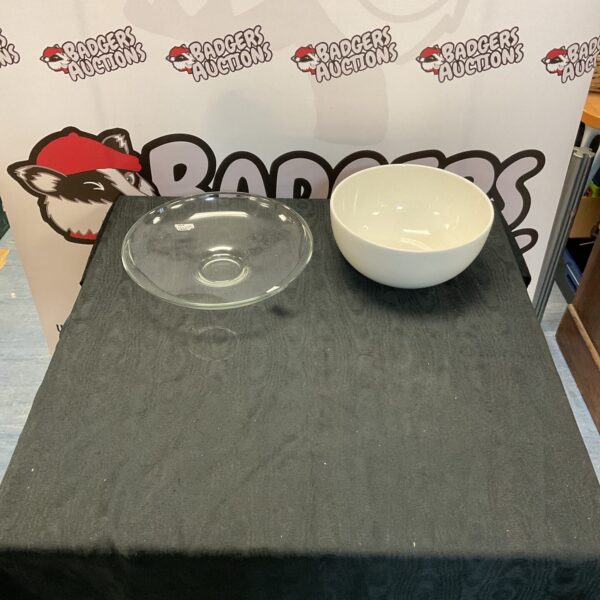 Elegant white porcelain serving bowl with clear glass plate.