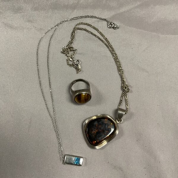 Vintage silver jewellery set with amber pendant and tigers eye ring.