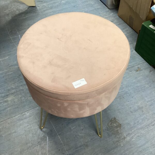 Pink velvet storage stool with a circular upholstered top.