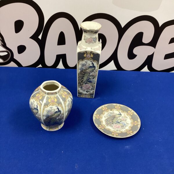 Vintage Japanese porcelain vase and plate with floral designs.