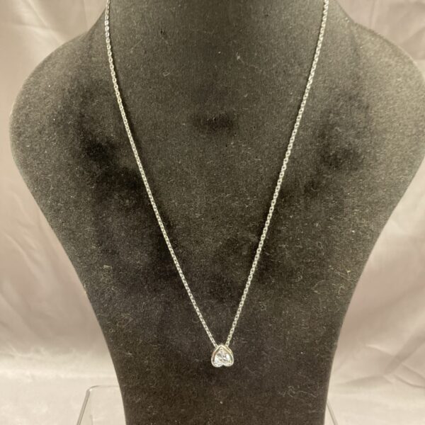 Elegant silver necklace with a white stone pendant.