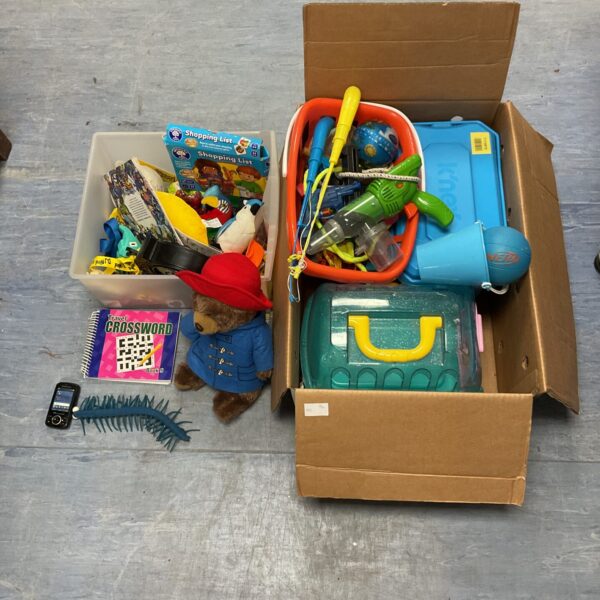 Mixed toy lot featuring Paddington Bear and water guns.