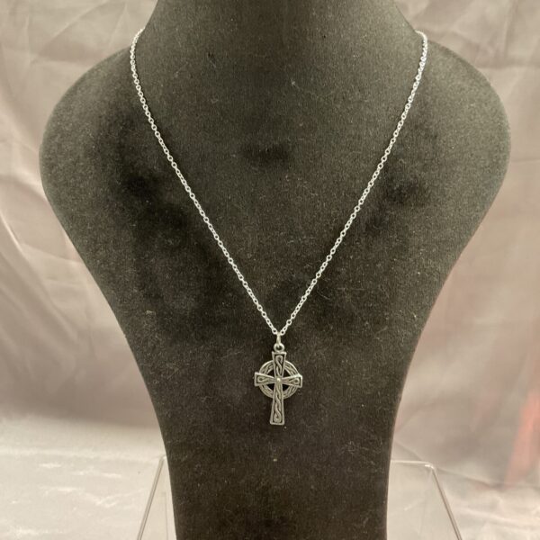 Silver Celtic cross pendant necklace with intricate knotwork design.