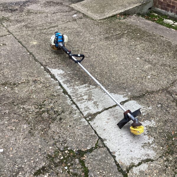 Used petrol strimmer for garden maintenance and landscaping.